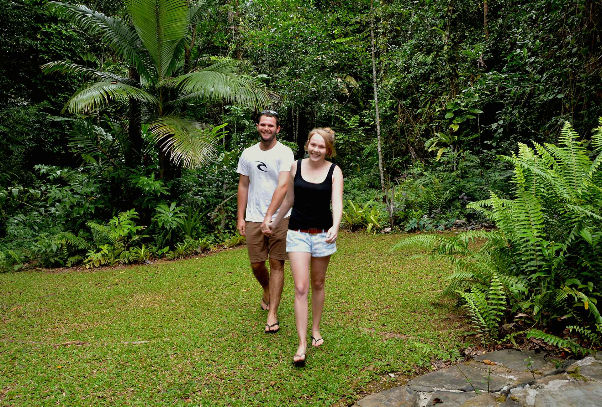 Deep Forest Lodge couple walking in garden