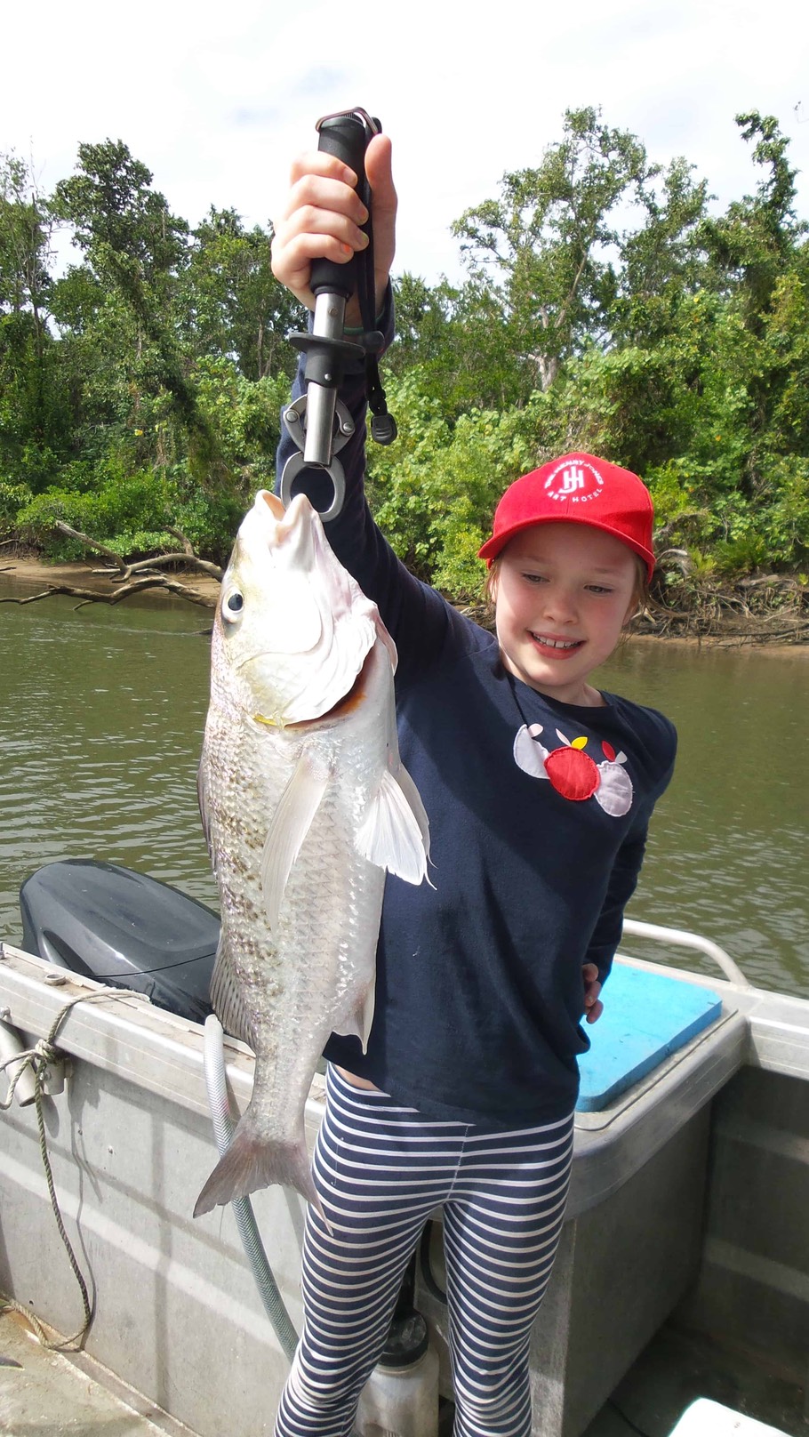 Another person holding a fish – Daintree River Fishing and Photography Tour