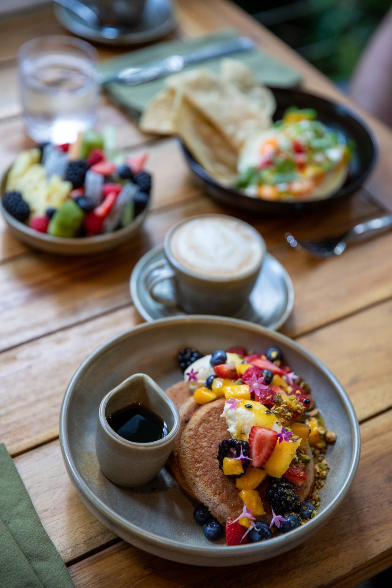 Breakfast pancakes with tropical fruit and coffee at Julaymba Restaurant