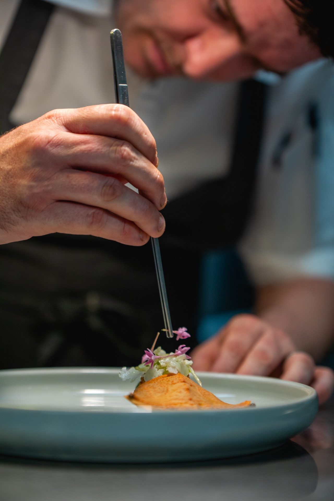 Chef plating a dish at Julaymba Restaurant